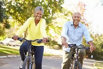 A couple enjoying a normal lifestyle after implant surgery.