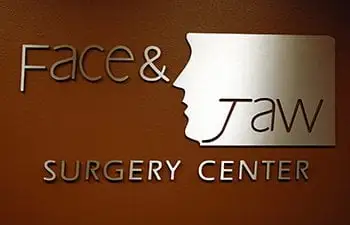 Wall logo at Grand Forks office of Face & Jaw Surgery Center