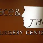 Wall logo at Grand Forks office of Face & Jaw Surgery Center