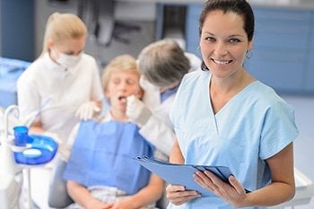 Dental staff taking care of a patient,